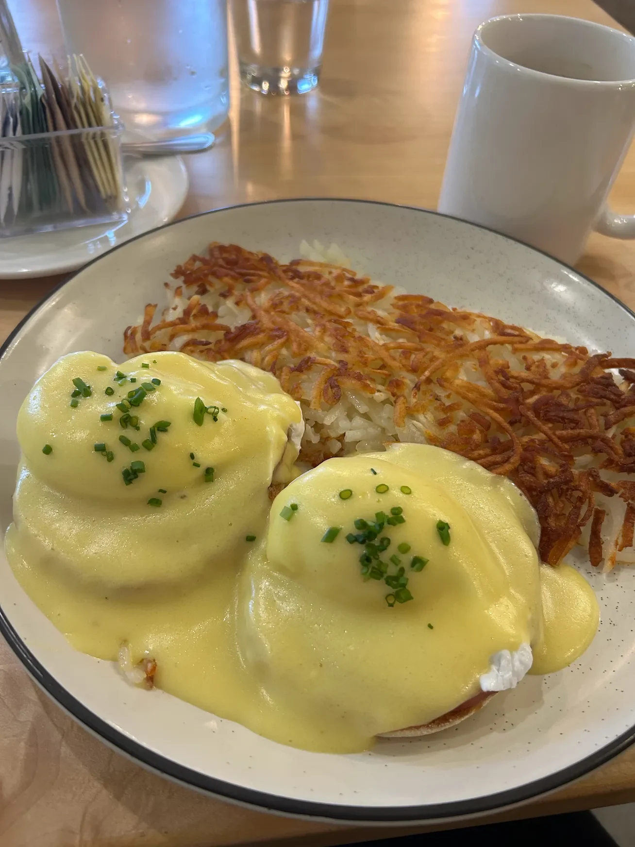 Classic two eggs breakfast plate with hash browns and toast at Corie's Cafe